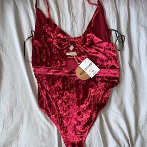 Red velvet bodysuit with tags